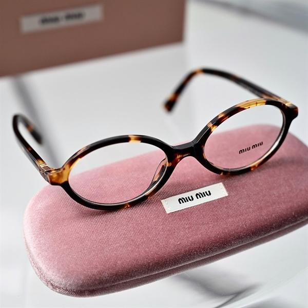 MiuMiu Glasses 0MU04ZS VAU08N